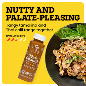 A black plate with some food in it on the yellow background. The border of the background is white. Pretty Thai Peanut Dipping and Dressing Sauce bottle alongside the plate. At the top left corner “ Nutty and Palate-Pleasing” is written in bold black font. Under this text “Tangy Tamarind and Thai Chili Tango Together” is written in black. Under this “Spice Level 2.5/5 ” is written in black and under this text there are 5 chilis present out of which 2.5 are red and others are white.