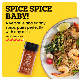 A white plate with some seafood in it is on a yellow background. The border of the background is white. Pretty Thai’s Thai Chili Powder bottle alongside the plate. At the top left corner “Spice Spice Baby!” is written in bold black font. Under this text “A versatile and earthy spice, pairs perfectly with any dish.” is written in black. Under this “Spice Level 4.5/5 ” is written in black and under this text there are 5 chilis out of which 4.5 are red and 1.5 are white.