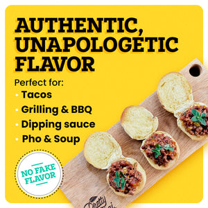 A cutting board with three open-faced sloppy joes topped with oregano on a yellow background. The border of the background is white. At the top left “Authentic, Unapologetic Flavor” is written in bold black font. Under this text 4 bullet points read “Tacos. Grilling & BBQ. Dipping Sauce. Pho & Soup." in black font. Under this there is a white circle badge with "No Fake Flavor" in blue font written on the inside.