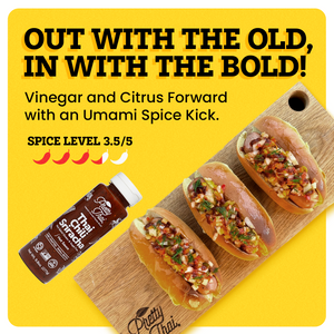 A cutting board with three hot dogs in buns topped with a relish on the yellow background. The border of the background is white. A bottle of Thai Chili Sriracha Hot Sauce alongside the food. At the top center “Out with the old, in with the bold” is written in bold black font. Under this text “Vinegar and citrus forward with an umami spice kick.” is written in black. Under this “Spice Level 3.5/5 ” is written in black; under this text there are 5 chilis present, of which 3.5 is red and others are white.