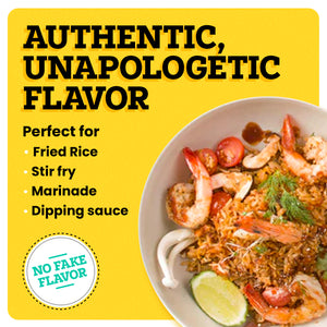 A white plate with shrimp in it is on a yellow background. The border of the background is white. At the top left corner “Authentic, Unapologetic Flavor” is written in bold black font. Under this text “Perfect for” is written in black. Under this text, white bullet points read “Fried Rice, Stir Fry, Grill Marinade, Dipping Sauce”. At the bottom left corner, a white icon reads “No Fake Flavor”.